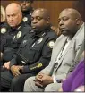  ?? Arkansas Democrat-Gazette/ STEPHEN B. THORNTON ?? Little Rock Police Chief Kenton Buckner (in suit) and members of his staff listen Tuesday night.
