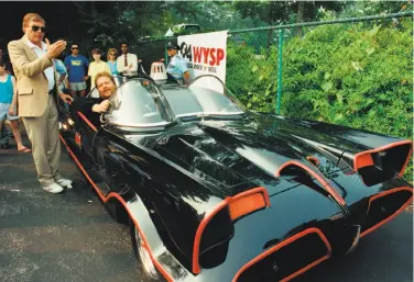  ?? Cristy Rickard / Associated Press 1989 ?? Adam West (left), who played Batman on TV in the 1960s, stands beside a Batmobile from the program driven by owner Scott Chinery in 1989. The Batmobile has been ruled to have copyright protection.