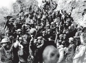  ?? AP ?? In this Nov 11, 1918 file photo, American troops cheer after hearing the news that the Armistice had been signed, ending World War I.