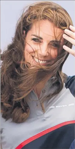  ??  ?? Windswept Kate watches a yacht race in Hampshire yesterday