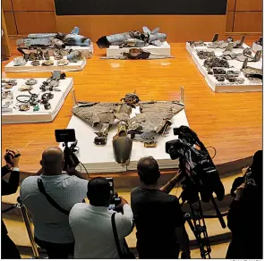  ?? AP/AMR NABIL ?? At a news conference Wednesday in Riyadh, Saudi military officials display what a Defense Ministry spokesman called debris from weapons used in the attack on oil facilities over the weekend.