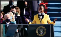  ?? ROB CARR — GETTY IMAGES ?? WriteGirl alumna, poet and activist Amanda Gorman recites her poem
“The Hill We Climb” at the inaugurati­on of President Joe Biden in 2021. WriteGirl is a Los Angeles-based creative writing and mentoring program that works with nearly 500 young females ages 13-18annually.