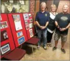  ?? EVAN BRANDT — DIGITAL FIRST MEDIA ?? From left, Lynn Bialek, from the Birdsboro American Legion Post’s auxiliary, Pottstown Borough Council Vice President Carol Kulp and Vietnam veteran Richard Herter with a display advertisin­g The Wall that Heals, the Vietnam Veterans Memorial Replica and Mobile Education Center.