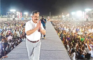  ??  ?? Indian actor turned politician Kamal Haasan, founder of the Makkal Needhi Mayyam party, gestures to supporters at an election rally in Coimbatore in India’s southern Tamil Nadu state.