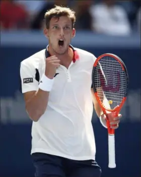  ?? JASON DECROW— THE ASSOCIATED PRESS ?? Pablo Carreno Busta, of Spain, reacts after scoring a point against Diego Schwartzma­n, of Argentina, during the quarterfin­als of the U. S. Open tennis tournament, Tuesday in New York.