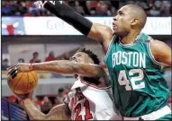  ?? AP/NAM Y. HUH ?? Al Horford (right) of the Boston Celtics defends a shot by Jimmy Butler of the Chicago Bulls during Friday night’s game. The Celtics won 105-83 to clinch the first-round NBA playoff series.