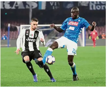  ?? — Reuters ?? Eyes on theball: Napoli’s Kalidou Koulibaly (right) in action against Juventus’ Mattia De Sciglio during the Serie A match at the San Paolo on Sunday.