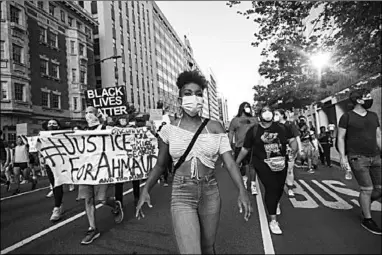  ??  ?? Aly Conyers, 17, joins the sixth day of protests in Washington after the death of George Floyd. (Photo: The Washington Post)