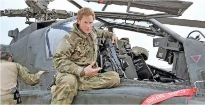  ??  ?? Prince Harry on December 12, 2012, after making his early morning pre-flight checks on his Apache helicopter, from Camp Bastion, southern Afghanista­n.