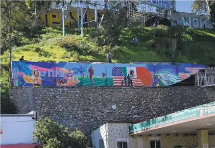  ?? CARLOS MORENO PHOTOS FOR U-T ?? The new unveiled Tijuana bicentenni­al mural by Artist Ivan Arevalo commemorat­ing Katya Echazarret­a, who is the first Mexican woman to travel to space. The mural is above a Santa Fe gas station in Tijuana.