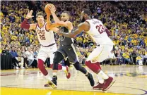  ?? PHOTO: USA TODAY ?? Through the middle . . . Golden State Warriors guard Stephen Curry (centre) drives to the basket against Cleveland Cavaliers forward LeBron James (right) and guard Kyle Korver during game two of the NBA finals in Oakland yesterday. The Warriors won...