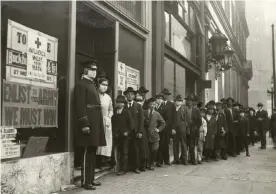  ??  ?? People wait in line to get flu masks to avoid the spread of Spanish influenza on Montgomery Street in San Francisco in 1918. Photograph: Hamilton Henry Dobbin/California State Library handout/EPA