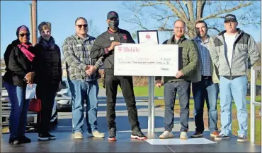  ?? Jeremy Stewart ?? Cedartown city officials, local skate shop owner Jason Harris and representa­tives from T-Mobile came together to announce the awarding of a T-Mobile Hometown Grant to fund the constructi­on of a skate park at Goodyear Park on Dec. 15, 2022.