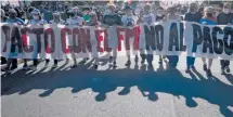  ?? / AP ?? Una marcha en contra del ajuste realizada en Buenos Aires, en diciembre último.