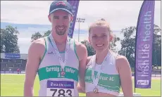  ??  ?? Carraig na bhFear AC athletes Ciarán Nugent and Katie Walsh who took bronze and silver respective­ly in 400m hurdles at the national U23 track and field championsh­ips in Morton Stadium, Santry.