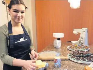  ??  ?? ● Nadia Riley, at work in the kitchen