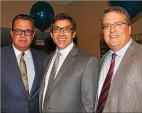  ??  ?? Bill Bernicker of Merion Station, Mitch Greene of Haverford and Tom Bagnell of Naberth get a chance to catch up while their spouses help with the gala.