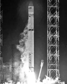  ??  ?? This handout picture provided by Russia’s Roscosmos space agency shows a Zenit rocket carrying Angosat-1, the first national telecoms satellite for Angola, lifting off from the launch pad at the Russian-leased Baikonur cosmodrome. — AFP photo