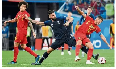  ?? — AFP ?? That’s mine: Belgium forward Eden Hazard (right) in action against France forward Olivier Giroud (centre) during the semi-finals at the St Petersburg Stadium on Tuesday.