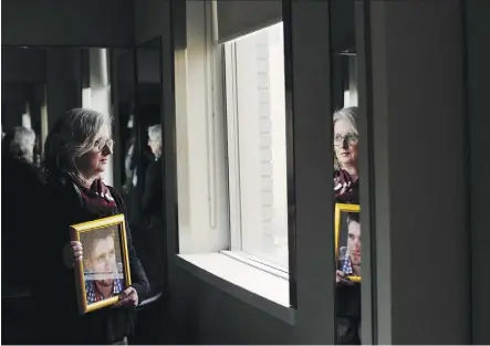  ?? AMBER BRACKENIA ?? Petra Schulz, an opioid crisis advocate who co-founded the group Moms Stop The Harm, holds a photograph of her son Danny Schulz, who died at age 25 from an accidental fentanyl overdose. Petra Schulz was in the new supervised consumptio­n site at Royal...