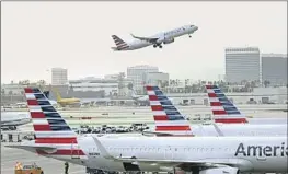  ?? Carolyn Cole Los Angeles Times ?? A PLANE takes off from Los Angeles Internatio­nal on Wednesday. Roughly 43% of LAX’s schedule was affected by the FAA systems outage, a spokespers­on said.