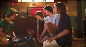  ??  ?? (From left) dustin (Gaten) updates his friends Will (Noah), Mike (Finn) and Eleven (Millie) about his summer.