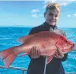  ?? Picture: SUPPLIED ?? COLOURFUL HANDFUL: This young angler braved the rough conditions on the reef with Cairns Reef Fishing and was rewarded with a quality largemouth nannygai.