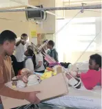  ??  ?? SHARING JOY: Parents and children from a local church donated toys to the children in Tygerberg Hospital’s paediatric ward.