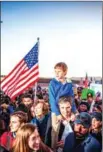  ?? CHRIST CHAVEZ/AFP ?? Beto O’Rourke carries his son during a border wall protest at the Mexican border on Monday.