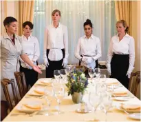  ??  ?? Women attend a lesson at the Switzerlan­d's last finishing school.