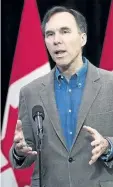  ?? NATHAN DENETTE/THE CANADIAN PRESS ?? Minister of Finance Bill Morneau speaks to the media before the Liberal cabinet retreat in London, Ont., on Friday.