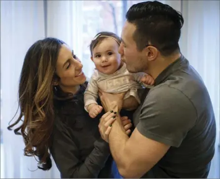  ?? BRIAN CASSELLA, TNS ?? Jordin Tootoo with his wife, Jen, and daughter Siena. Today, Tootoo says he is a husband and father first, and a hockey player second.