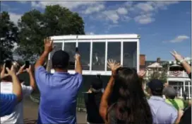  ?? CAROLYN KASTER — THE ASSOCIATED PRESS ?? President Donald Trump looks out from his presidenti­al viewing stand to the cheering and waving crowd Saturday during the U.S. Women’s Open at Trump National Golf Club in Bedminster, N.J.