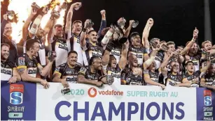  ?? Picture: GETTY IMAGES/ CAMERON SPENCER ?? VICTORY: The Brumbies celebrate during the trophy presentati­on after winning the Super Rugby AU Grand Final between the Brumbies and the Reds at GIO Stadium on Sunday in Canberra, Australia.