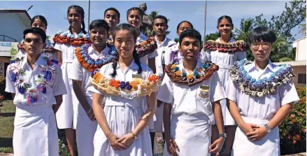  ?? Photo: Mereleki Nai ?? Head Girl, Zu Feng Liu (standing second left) and Head Boy Raynesh Charan (3rd left) with all the head prefects at Swami Vivekanand­a College (SVC) in Nadi.