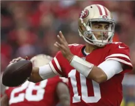  ?? NHAT V. MEYER, TNS ?? San Francisco 49ers quarterbac­k Jimmy Garoppolo looks downfield against the Jacksonvil­le Jaguars on Sunday.