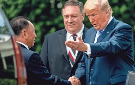  ??  ?? President Donald Trump and Secretary of State Mike Pompeo speak with Kim Yong Chol, one of North Korean leader Kim Jong Un’s closest aides, after their meeting Friday at the White House.