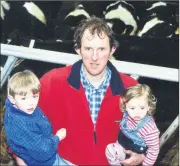  ?? ?? Photograph­ed at a gathering of dairy heifers for an airlift by Bóthar to poverty stricken families in Kosovo in 2002 were John, Stephen and Jessica Condon from Mitchelsto­wn.