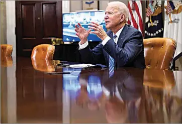  ?? ANDREW HARNIK / AP ?? President Joe Biden congratula­tes NASA’s Jet Propulsion Laboratory Mars 2020 Perseveran­ce team for successful­ly landing on Mars during a virtual call in the Roosevelt Room at the White House on Thursday.