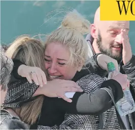  ?? GEOFF CADDICK / AFP / GETTY IMAGES ?? Relatives of the victims of the 1989 Hillsborou­gh disaster react following the conclusion of the inquest, where a jury found that the 96 Liverpool fans who died in were unlawfully killed in a tragedy caused by police blunders.