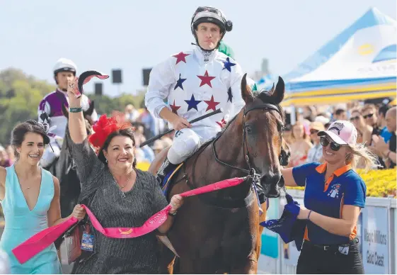  ?? Picture: ADAM HEAD ?? Sunlight and jockey Luke Currie bask in the glory of their win in the Magic Millions 2YO Classic on the Gold Coast.