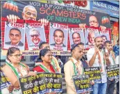  ??  ?? Congress workers protest against the Union government regarding the financial frauds in Mumbai on Friday.