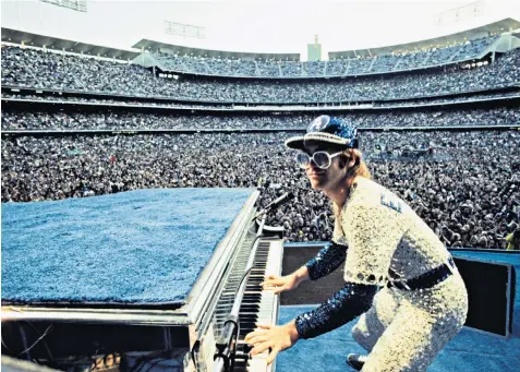  ??  ?? Above: Elton John performing in Los Angeles in 1975. Right, with Diana, Princess of Wales in 2004. Top right: with Lady Gaga