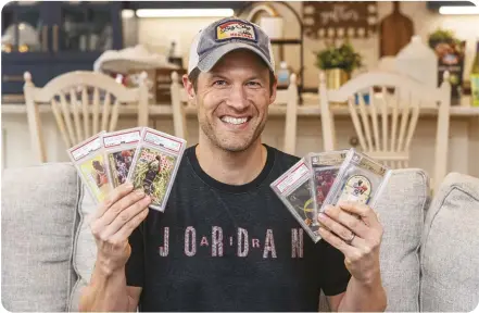  ??  ?? Michael Jordan collector Joe Sandin shows off some of his key 1990s cards. Sandin is an active member in the Michael Jordan Cards Buy Sell Trade Facebook group, which has more than 5,300 members.