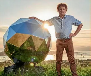  ??  ?? Rocket Lab founder Peter Beck with the ‘‘humanity star’’ satellite, launched from one of its successful missions.