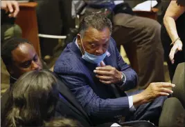  ?? JULIO CORTEZ — THE ASSOCIATED PRESS ?? The Rev. Jesse Jackson talks with others in at North Central University Thursday, June 4, 2020, before a memorial service for George Floyd in Minneapoli­s.