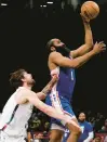  ?? DECROW/AP JASON ?? The 76ers’ James Harden shoots over the Nets’ Joe Harris during Saturday’s game.