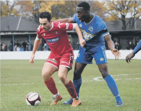  ??  ?? Scarboroug­h Athletic’s Luke Lofts gets to grips with a Radcliffe opponent during Saturday’s 3-1 defeat
PICTURES BY MORGAN EXLEY