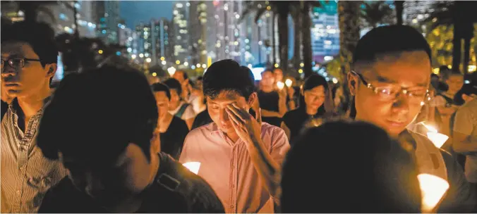  ??  ?? A candleligh­t vigil in Hong Kong to mark the 30th anniversar­y of the 1989 Tiananmen massacre.