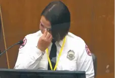  ?? IMAGE FROM VIDEO VIA AP ?? Minneapoli­s firefighte­r Genevieve Hansen wipes her eyes as she testifies Tuesday in the trial of former Minneapoli­s police Officer Derek Chauvin, who is accused of killing George Floyd.